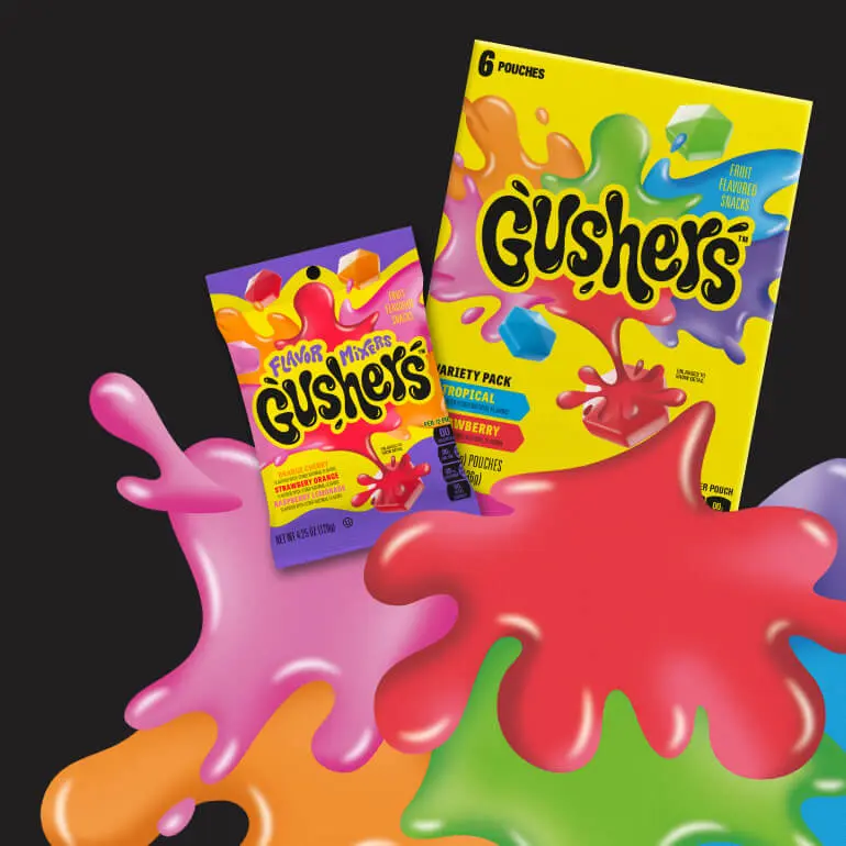 Flavor Mixers Gushers pouch and Variety Pack Gushers box, front of pack on a black background with colorful splats in front of them